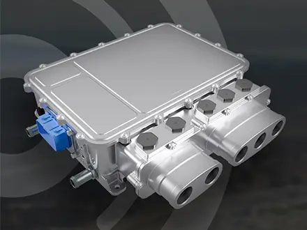 A silver IPG5 automotive inverter with multiple ports and a blue connector is displayed on the left against a dark background with circular graphic accents.