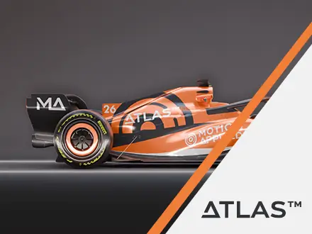 Side view of an orange and black Formula‑style race car with Atlas and Motion Applied branding, partially overlaid by a diagonal graphic with the ATLAS™ logo on a light background.