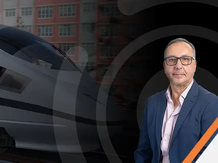 Man stood in front of train with the words "Moin Majid leads Motion Applied's APAC expansion"