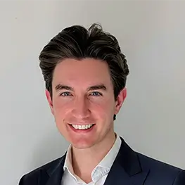 Paolo Bargiacchi, Director, Electrification, wearing a dark suit jacket over a white collared shirt, posed against a plain light-colored background.