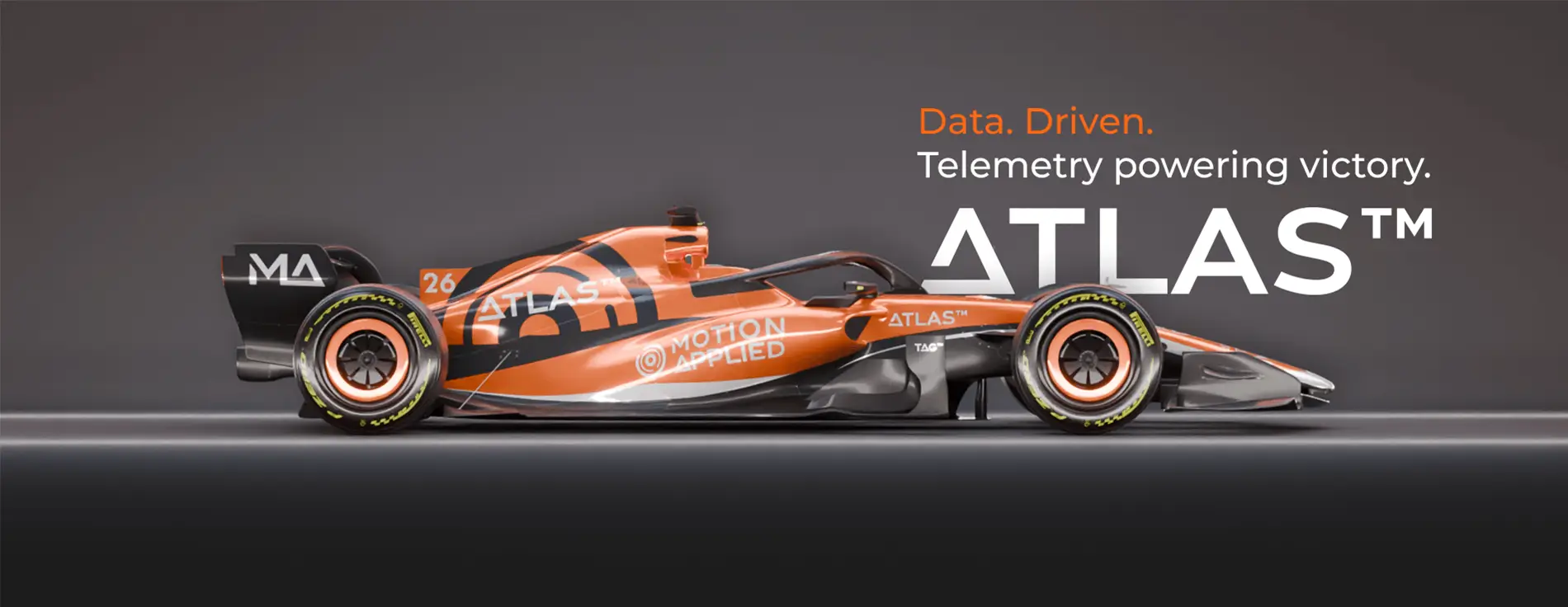 Side view of an orange and black Formula‑style race car with Motion Applied and Atlas branding, shown on a dark background with the text ‘Data. Driven. Telemetry powering victory. ATLAS™